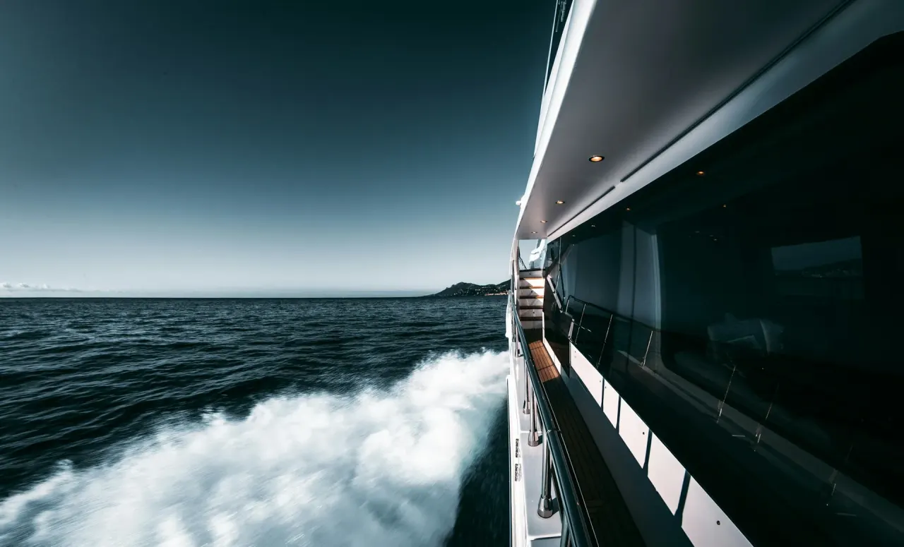 Luxury motor yacht underway on blue Mediterranean water